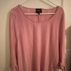 NWOT soft pink blouse with ruffled sleeves.